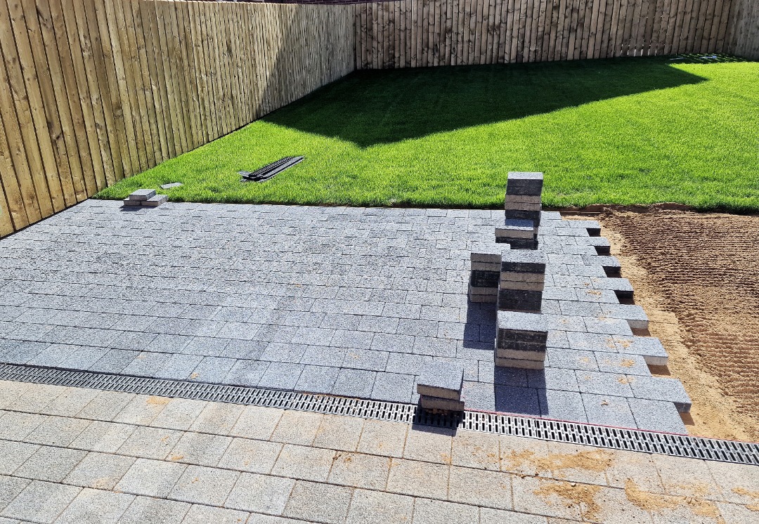 A professional paver patio that is under construction.