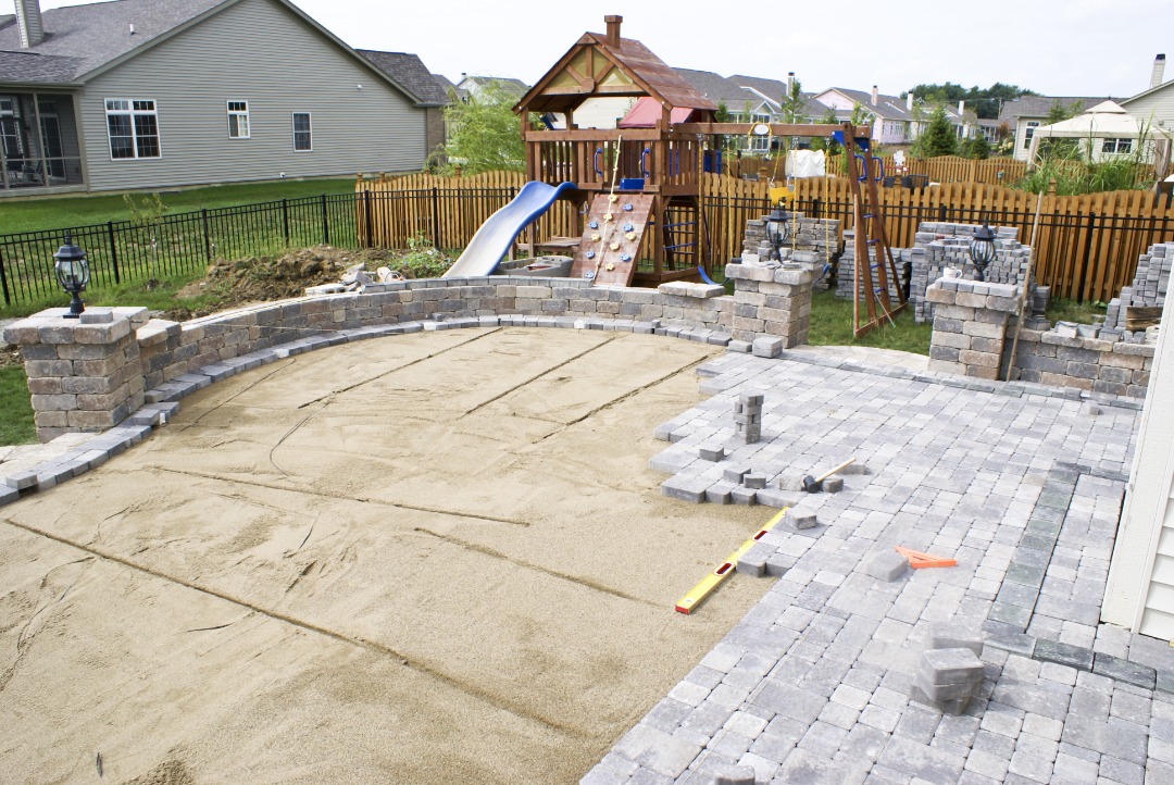 A patio that is being installed by professionals.